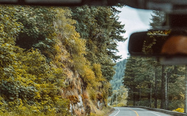 An empty road curving through open countryside