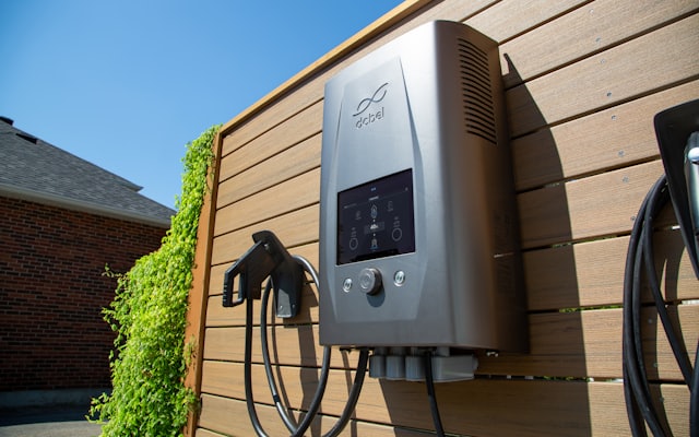 An electric vehicle charger mounted on a wall