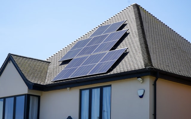 Rows of solar panels on the roof of a modern home