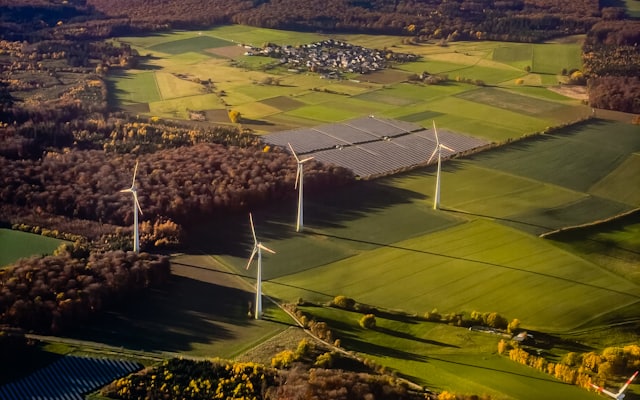 Wind turbines and solar panels in a rural landscape